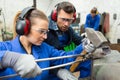 workers shaping metal with hammer over anvil Royalty Free Stock Photo