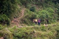 2 workers with shovels and dog along Li River, Guilin, China