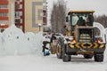 Workers shovels to remove the snow on the ice town Royalty Free Stock Photo