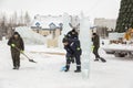 Workers shovels to remove the snow on the ice town Royalty Free Stock Photo
