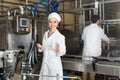 Workers showing dairy production process