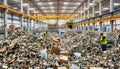 Workers Sorting Waste Recycling Materials in Large Industrial Facility Royalty Free Stock Photo