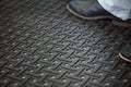 Workers standing on anti-fatigue mat in an industrial kitchen