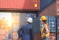 Workers standing in front of containers Royalty Free Stock Photo