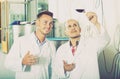 Workers standing with glass of wine Royalty Free Stock Photo