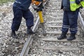 Workers start removing clips from the railway tracks Royalty Free Stock Photo