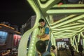 Workers at a street crossing to debug a light circuit, night view