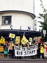 Workers strike over living wage and job cuts