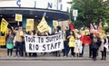 Workers strike over living wage and job cuts