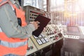 Workers with tablet in hand in control room of rig drilling Royalty Free Stock Photo