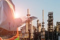 Workers with tablet in hand in oil refinery plant Royalty Free Stock Photo