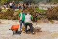 Workers take out Cozido in Furnas