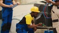 Workers tasked with condenser cleaning
