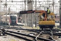 Workers with tie crane doing the railroad maintenance at Ljubljana train station Royalty Free Stock Photo