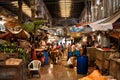 Workers and traders of the old city market clean counters and wash the floor