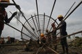 Workers tying up a pillar at the construction site