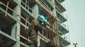 workers in uniform and protective masks are welding the structure on the construction Royalty Free Stock Photo