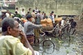 Workers unload boats in busy port Dhaka