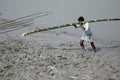 Workers unload cargo from the boat in Gosaba, India