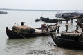 Workers unload cargo from the boat in Gosaba, India