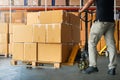 Workers Unloading Package Boxes on Pallets in Warehouse. Supply Chain Shipment Goods. Distribution Supplies Warehouse Logistic. Royalty Free Stock Photo