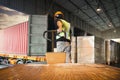 Workers Unloading Package Boxes on Pallets in Warehouse. Delivery. Cargo Load with Shipping Container. Freight Truck Logistics.