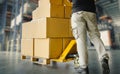 Workers Unloading Packaging Boxes on Pallet in Storage Warehouse. Cardboard Boxes. Shipping Supplies Warehouse. Shipment Boxes. Royalty Free Stock Photo