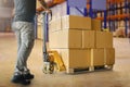 Workers Unloading Packaging Boxes on Pallet in The Warehouse. Cardboard Boxes. Shipping Supplies Warehouse. Shipment Boxes. Royalty Free Stock Photo