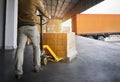 Workers Unloading Packaging Boxes on Pallets into The Cargo Container Trucks. Loading Dock. Shipping Warehouse. Delivery. Shipment Royalty Free Stock Photo