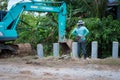 Workers urgently repairing and building retaining wall .