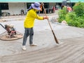Workers use brooms to make marks to make the concrete road surface Royalty Free Stock Photo