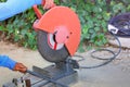 Workers use red electric steel cutter machine