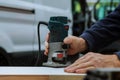 workers using electric routering to cut down stripes Royalty Free Stock Photo