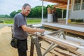 workers using electric routering to cut down stripes Royalty Free Stock Photo