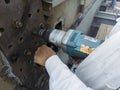 Workers are using a Impact Wrench to torque bolts to hold the splice plate with steel girder at splice joint of steel structure Royalty Free Stock Photo