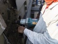 Workers are using a Impact Wrench to torque bolts to hold the splice plate with steel girder at splice joint of steel structure Royalty Free Stock Photo