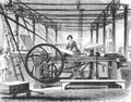 Workers using the power press