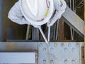 Workers are using a wrench to torque bolts to hold the splice plate to the steel beam of steel structure work Royalty Free Stock Photo