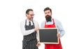 Workers wanted. Bartender with blackboard. Hipster bartender show blackboard copy space. Men bearded hipster informing Royalty Free Stock Photo