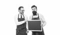 Workers wanted. Bartender with blackboard. Hipster bartender show blackboard copy space. Men bearded hipster informing Royalty Free Stock Photo