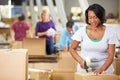 Workers In Warehouse Preparing Goods For Dispatch Royalty Free Stock Photo