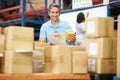 Workers In Warehouse Preparing Goods For Dispatch