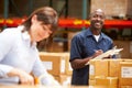 Workers In Warehouse Preparing Goods For Dispatch