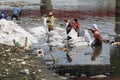 Workers wash chemical-mixed polythene sheets