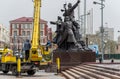 Workers wash the monument.