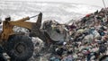 Workers at the waste processing plant. Sorting trash on a conveyor belt