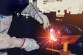 Welder is welding metal steel pipe in factory Royalty Free Stock Photo