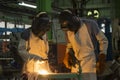 Workers are welding metal