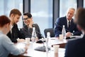 Workers Whispering in Business Meeting Royalty Free Stock Photo
