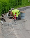 Workers who are laying the cables for the connection of the optical fiber